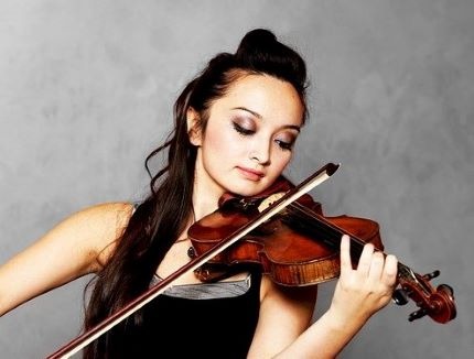 Awakened Alchemy Review - Solo Violinist Concentrating on her Playing