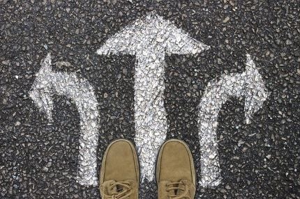 Three arrows on ground pointing in different directions.