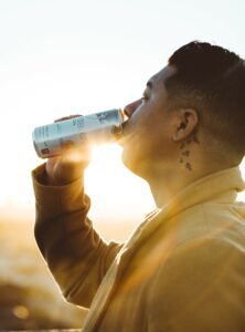 Does-Caffeine-Help-with-Focus - Man Chugging an Energy Drink