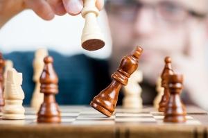 The Best Memory Supplements for Seniors - Chess Player Taking a Pawn