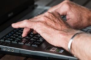 The Best Memory Supplements for Seniors - Elderly Man's Hands Typing