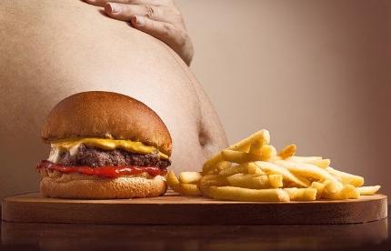 Best Supplement for Energy and Concentration - Burger and Fries in Front of Fat Tummy