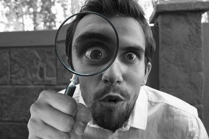 Best Supplement for Energy and Concentration - Man Inspecting Further with Magnifying Glass