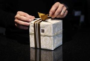 How does CoQ10 Benefit the Brain - Man Wrapping a Present