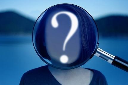 Is Sage a Nootropic - Woman's Face Covered with Magnifying Glass and Question Mark